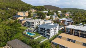 an aerial view of a city with buildings at Sundeck Shoal Bay Ground floor with views and pool access in Shoal Bay