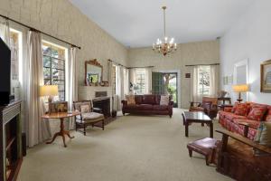 a living room with couches and a fireplace at Live Oak Ranch in Spring Branch