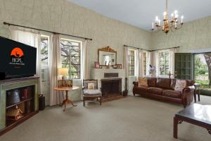 a living room with a couch and a fireplace at Live Oak Ranch in Spring Branch +31 photos