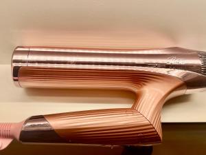 a close up of two hair brushes on a wall at A Sleeping Forest in Ito
