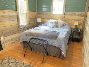 a bedroom with a bed and two windows at Buckhorn Lookout in Custer