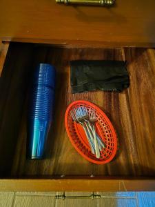 a wooden table with a plate and utensils at Casa de Chacha in Guanajuato
