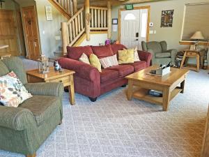 a living room with two couches and a coffee table at Cottage at Storm Mountain #5 in Hill City +14 photos