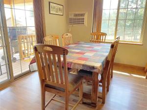 a dining room table with chairs and a table and a table and chairsktop at Gold Mill in Hill City +15 photos