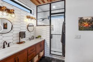 a bathroom with a sink and a shower at Canyon Tree House in Canyon Lake +38 photos