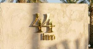 a sign that says hindu on a wall at 44 Inn in Dahab
