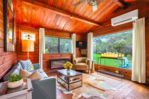 a living room with a couch and a fireplace at Canyon Vista in Wimberley