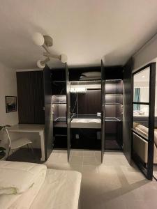 a bedroom with two bunk beds and a ceiling fan at Sydney Homestay in Mölndal