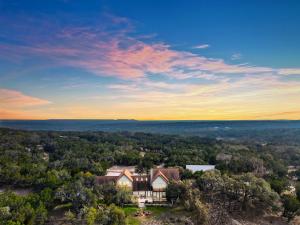 an aerial view of a house in the woods at Casa Robles- The Mockingbird in Wimberley