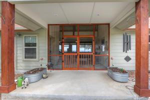 a front door of a house with two large pots at Casa Robles- The Mockingbird in Wimberley +23 photos