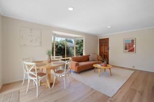 a living room with a table and a couch at Cowes Monash Hideaway in Cowes