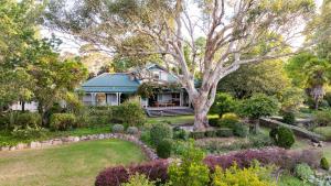 a house with a garden in front of it at Breathe Glenrock Gardens in Tenterfield +16 photos