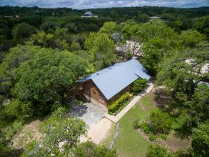 an overhead view of a barn in the trees at Clearwater Log Home in Wimberley