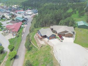 an aerial view of a village with a road and houses at Iron Horse Lookout in Hill City
