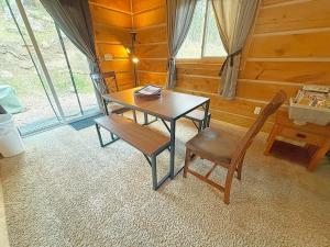 a dining room with a table and two chairs at Schuster's Cabin in Custer