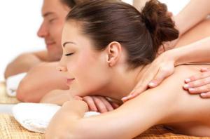 a woman laying on a towel in a bath tub at Hotel Noto Marina Scirocco & SPA in Noto Marina