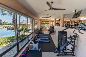 an image of a gym with treadmills and ellipticals at Villa Santa Cruz in Todos Santos