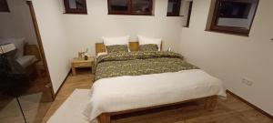 a bedroom with a bed in a room at Woodlight Loft - Sauna & Nature Escape near Rothenburg ob der Tauber - Self Check-in in Diebach