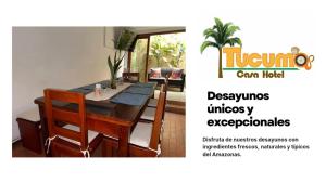 a dining room with a table and chairs at Tucuma Casa Hotel in Leticia +2 photos