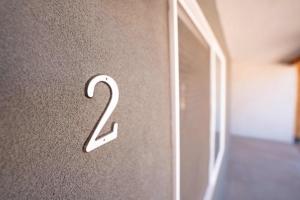 a number on the wall of a room at Red Rock Views Tiny Suite Kanab Basecamp in Kanab