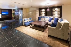 a living room with couches and a table at Hotel Mystays Premier Hamamatsucho in Tokyo +27 photos