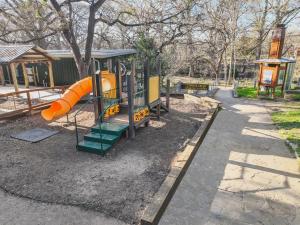 a playground with an orange slide at a park at Cowboy Casita in Wimberley