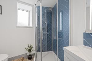 a bathroom with a shower and a toilet at Regent Apartments, York in York