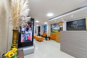 a lobby of a hotel plaza muzico with a reception at Hotel Plaza Muisca in Tunja