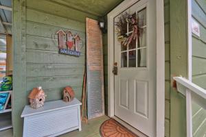 a front door of a house with a bird house at Creekside Cabins - The Nest in Wimberley +8 photos