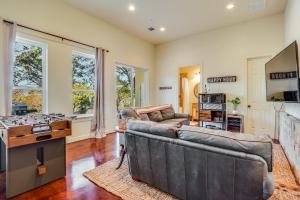 a living room with a couch and a fireplace at Riviera Lake House in Canyon Lake