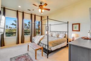 a bedroom with a bed and a ceiling fan at Riviera Lake House in Canyon Lake