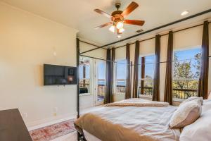 a bedroom with a bed and a ceiling fan at Riviera Lake House in Canyon Lake