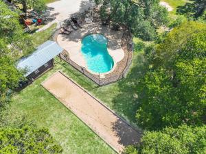 an overhead view of a swimming pool in a park at Wimberley Log Cabins Resort and Suites- The Oak Lodge in Wimberley