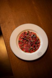 a plate of food on a wooden table at Larch House in Whitefish