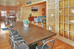 a dining room with a table and chairs at Wimberley Log Cabins Resort and Suites- Reunion Cabin in Wimberley