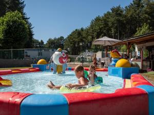 two children in a pool at a water park at Breebos Chalet near Antwerp Camp in Rijkevorsel