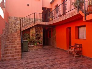 an empty courtyard of a house with a staircase at HOSPEDAJE EIMy in Purmamarca +5 photos