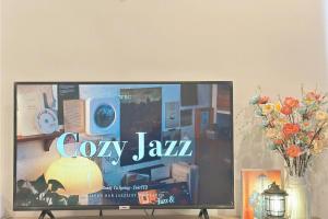 a flat screen tv sitting on top of a table at The Song Luxury Near Beach Apartment - Căn hộ Nghỉ Dưỡng Cao Cấp Cạnh Biển - Moonlight Homestay in Vung Tau