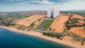 an aerial view of a beach and a tall building at Mandala Cham Bay Mui Ne in Ấp Thiẹn Ái +56 photos