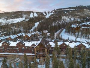 a lodge in the mountains covered in snow at Bear Creek Lodge 203C Hotel Room in Telluride