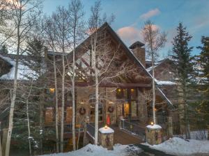 a home in the winter with snow on the ground at Bear Creek Lodge 203C Hotel Room in Telluride