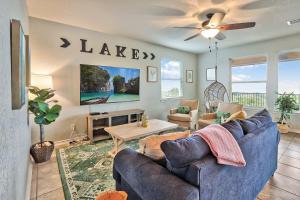 a living room with a couch and a table at Scenic Terrace in Canyon Lake