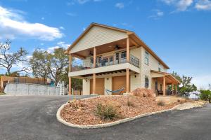 a house with a balcony on the side of the road at Scenic Terrace in Canyon Lake