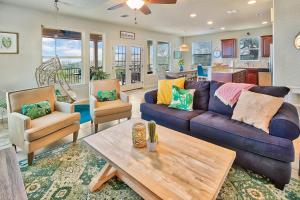 a living room with a couch and a table at Scenic Terrace in Canyon Lake