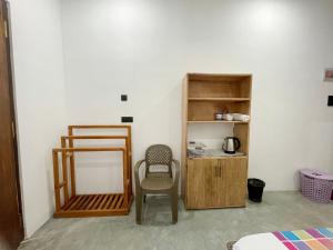 a room with a mirror and a chair in it at Coffee Shade in Midigama East