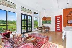a living room with a couch and a table at Wild Candy-Plum Wild in Wimberley