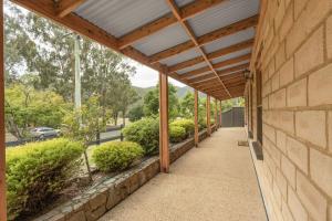 a porch of a house with a wooden roof at Route 86 Bright in Bright