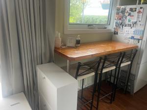 a small desk in a kitchen with a window at The Ginger Bread House in Mount Beauty +12 photos