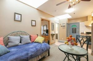 a living room with a bed and a table at Ocean Breeze Executive Bed and Breakfast in North Vancouver