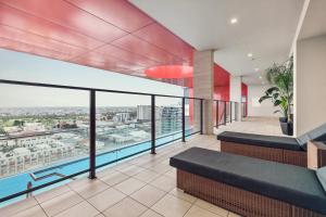 a balcony of a building with a swimming pool at Two Bedroom Unit in Central Adelaide in Adelaide